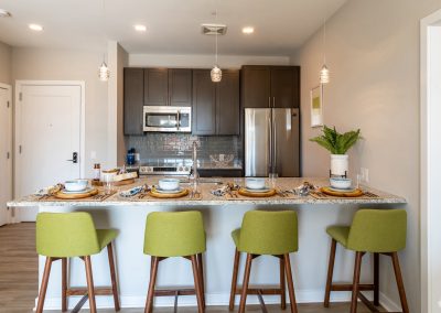 Breakfast bar with stools in a kitchen in an apartment at the Residences at Bentwood in Plymouth Meeting