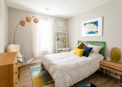 Model bedroom with bed, desk, dresser and other bedroom furniture in an apartment at the Residence at Bentwood in Plymouth Meeting